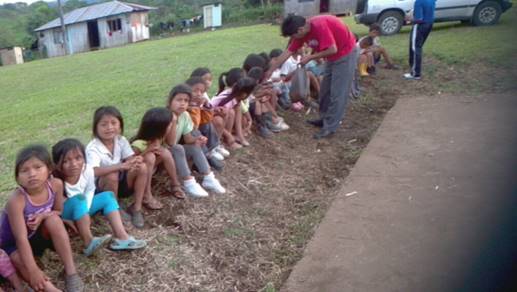 Children lining up for treats in Chivios, Ecuador.
